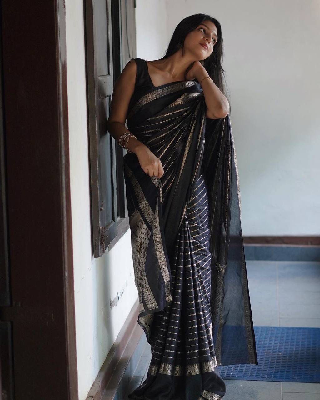 Voluptuous Black Color Soft Lichi Silk Saree With Blouse Piece