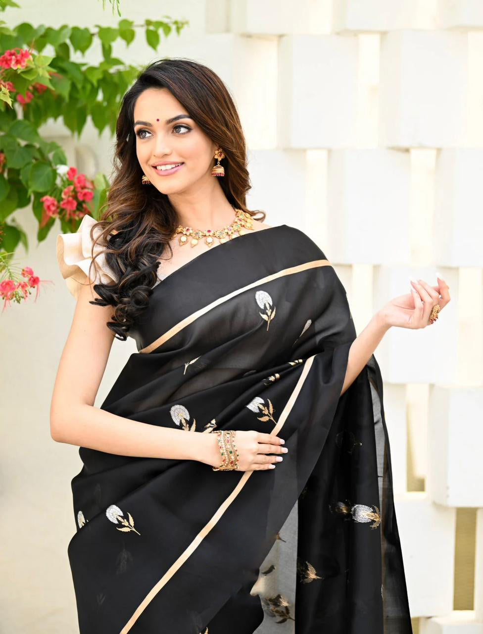 Dynamic Black Color Soft Lichi Silk Saree With Blouse Piece