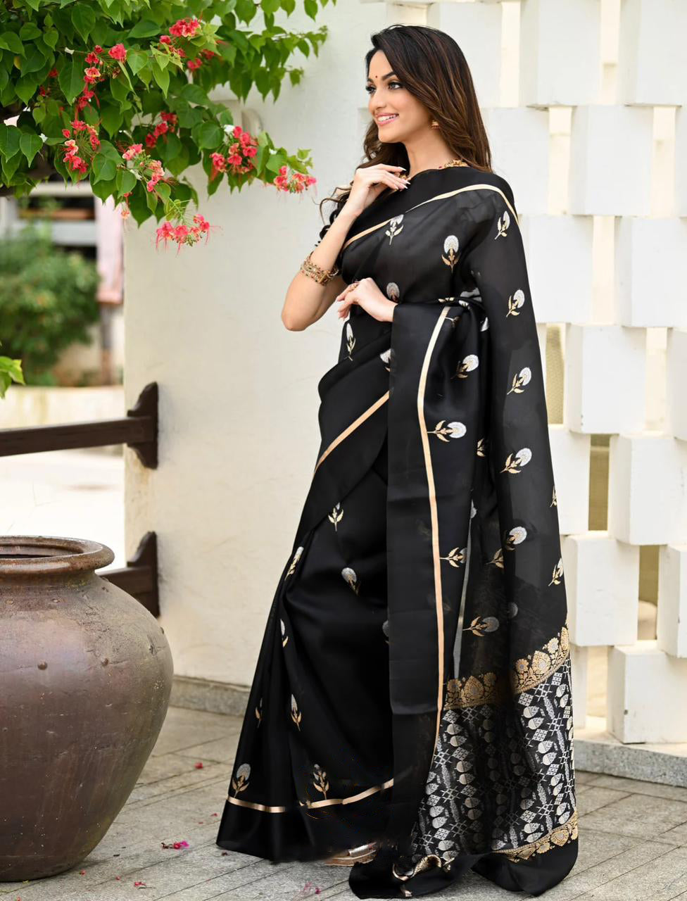 Dynamic Black Color Soft Lichi Silk Saree With Blouse Piece