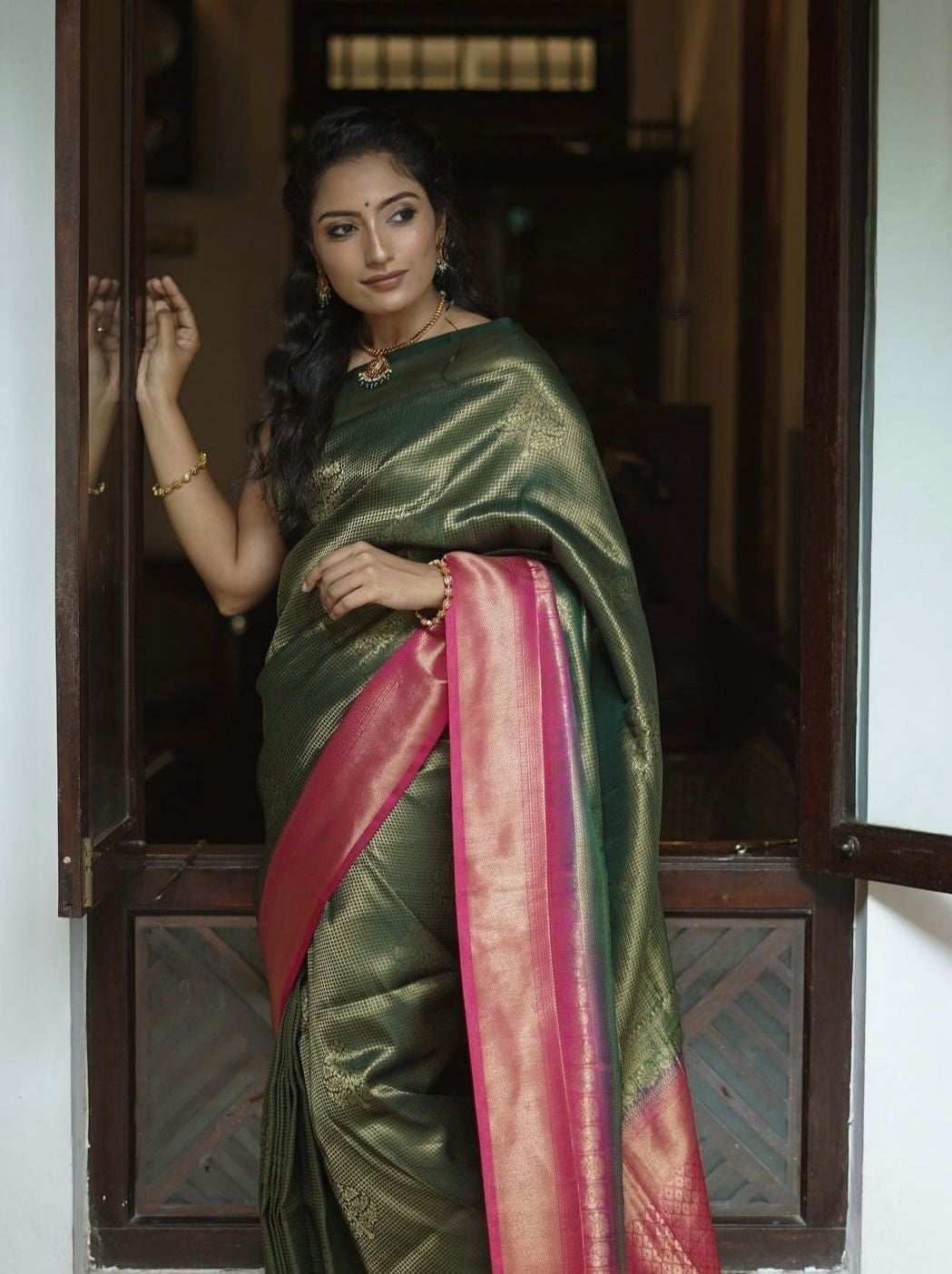 Luminescent Dark Green Color Soft Lichi Silk Saree With Blouse Piece