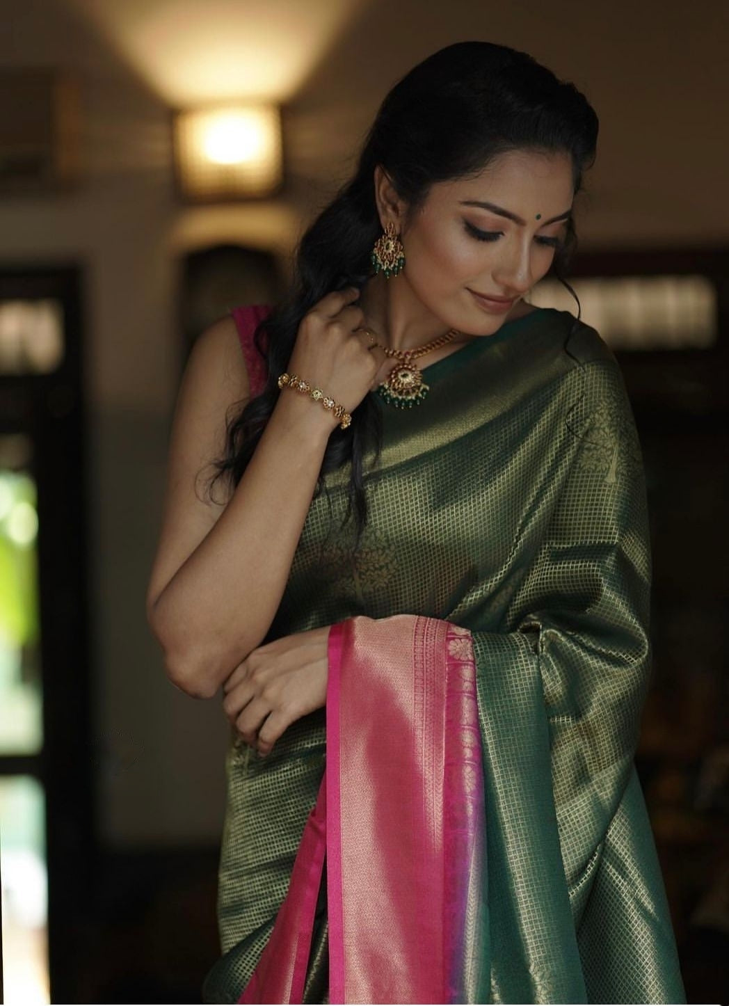 Luminescent Dark Green Color Soft Lichi Silk Saree With Blouse Piece