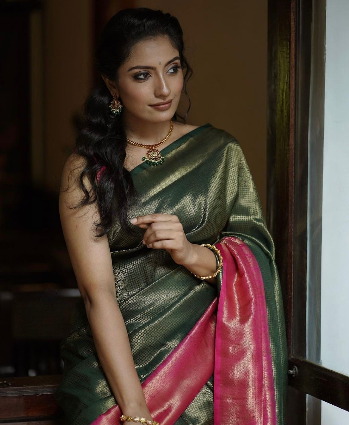 Luminescent Dark Green Color Soft Lichi Silk Saree With Blouse Piece