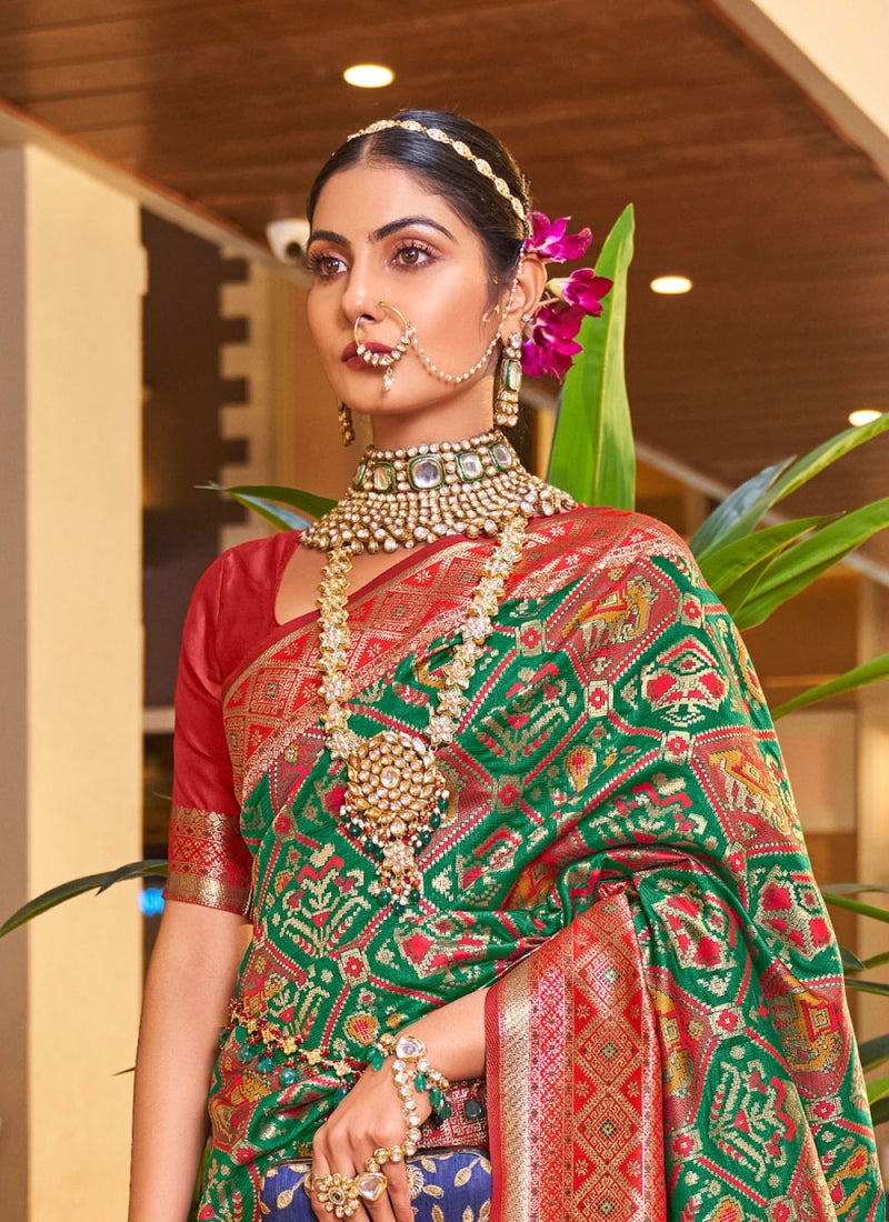 Mystical Dark Green Color Patola Silk Saree With Blouse Piece