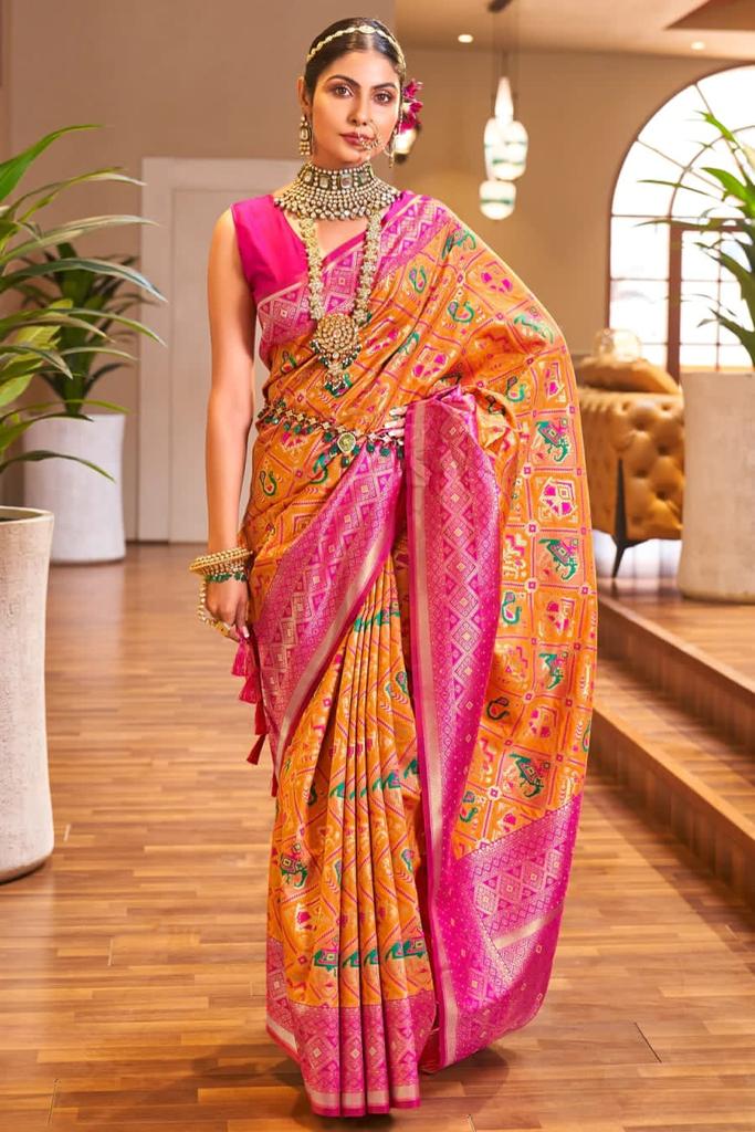 Enchanting Orange Color Patola Silk Saree With Blouse Piece