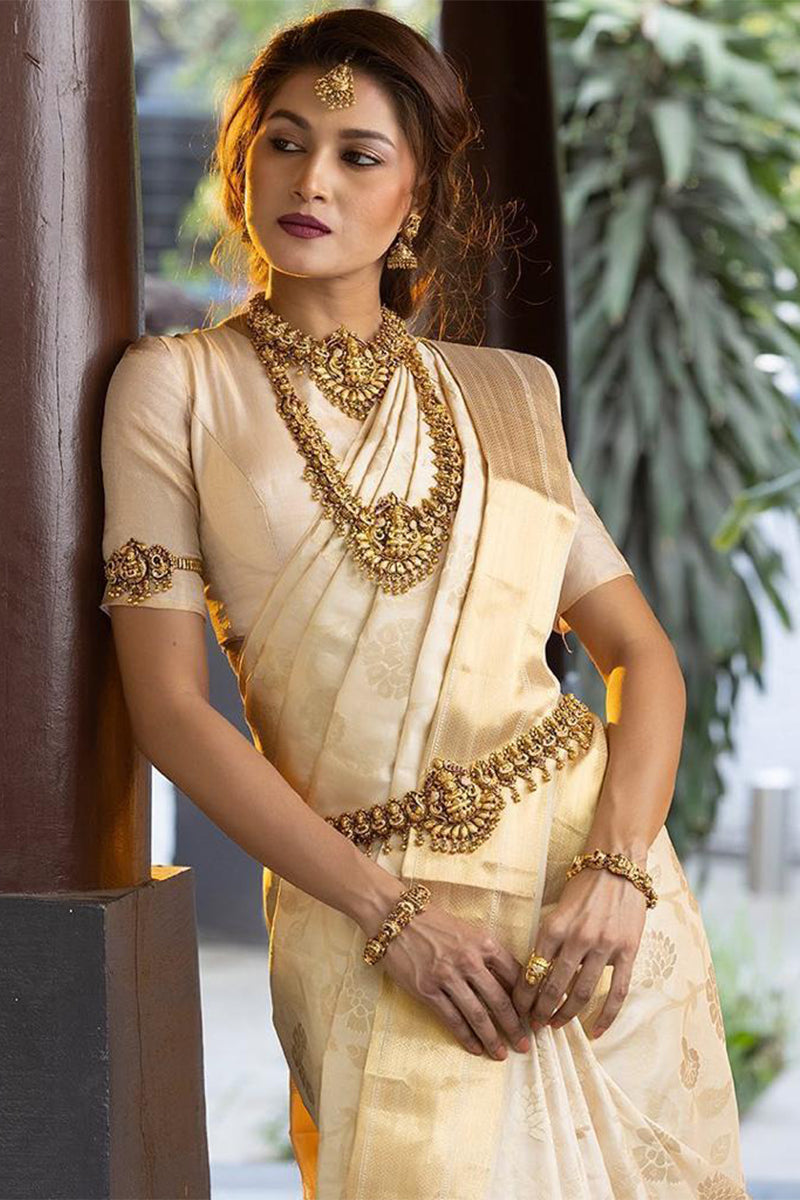 Scintillant Beige Color Banarasi Soft Silk Saree With Blouse Piece