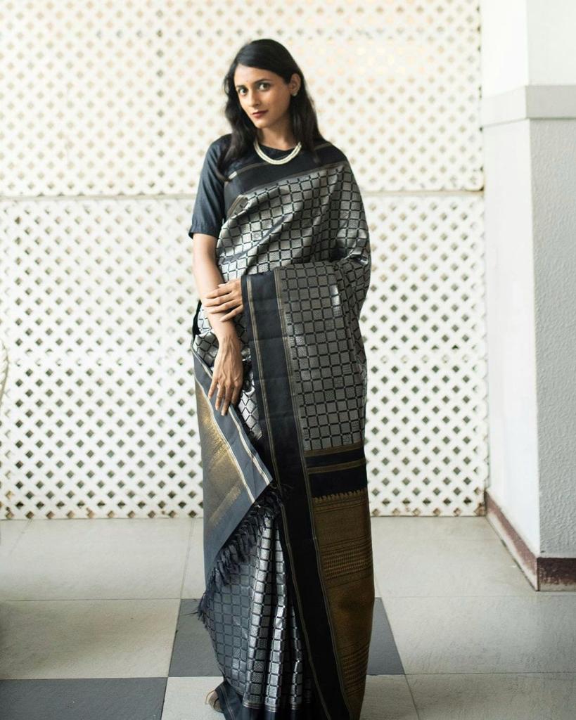 Rousing Black Color Soft Lichi Silk Saree With Blouse Piece