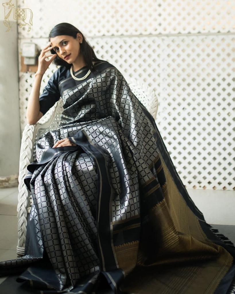 Rousing Black Color Soft Lichi Silk Saree With Blouse Piece