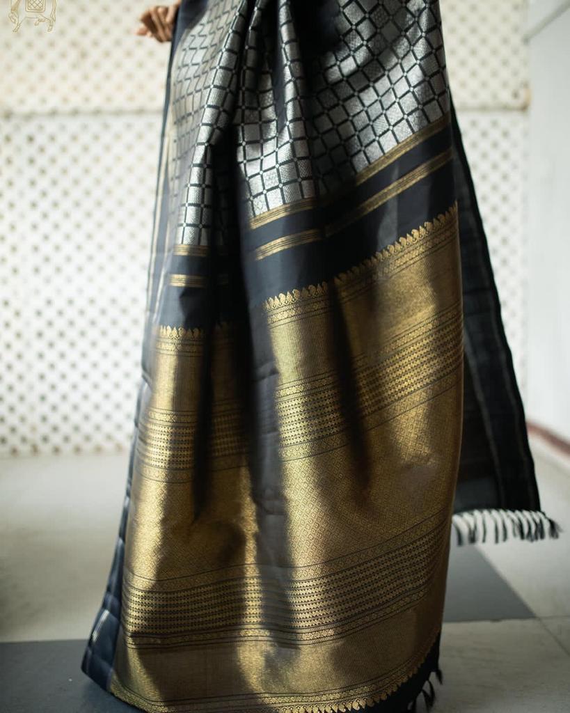 Rousing Black Color Soft Lichi Silk Saree With Blouse Piece