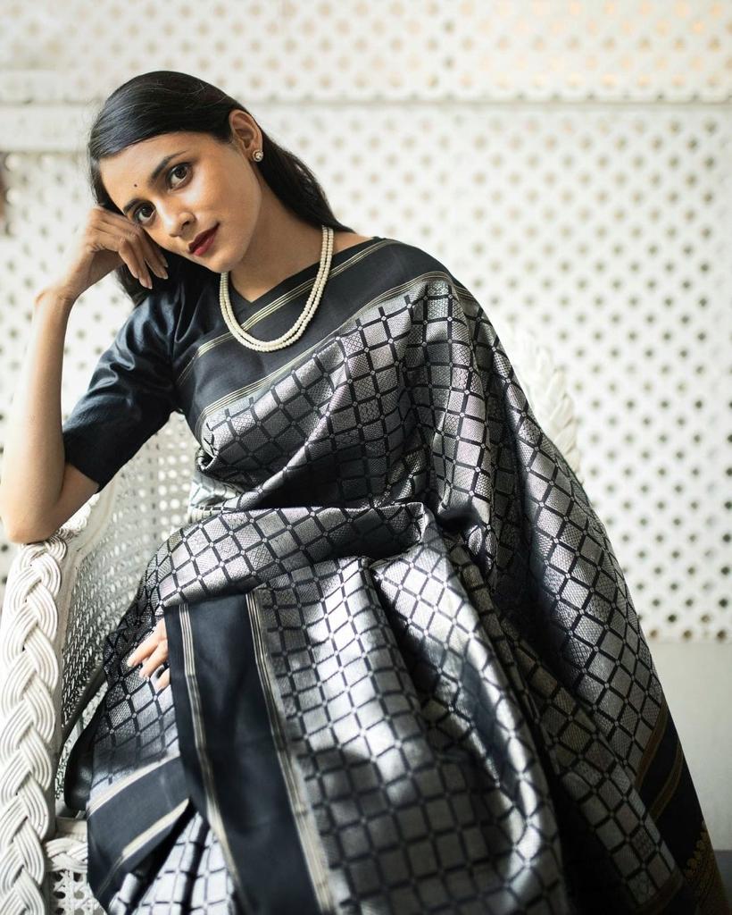 Rousing Black Color Soft Lichi Silk Saree With Blouse Piece