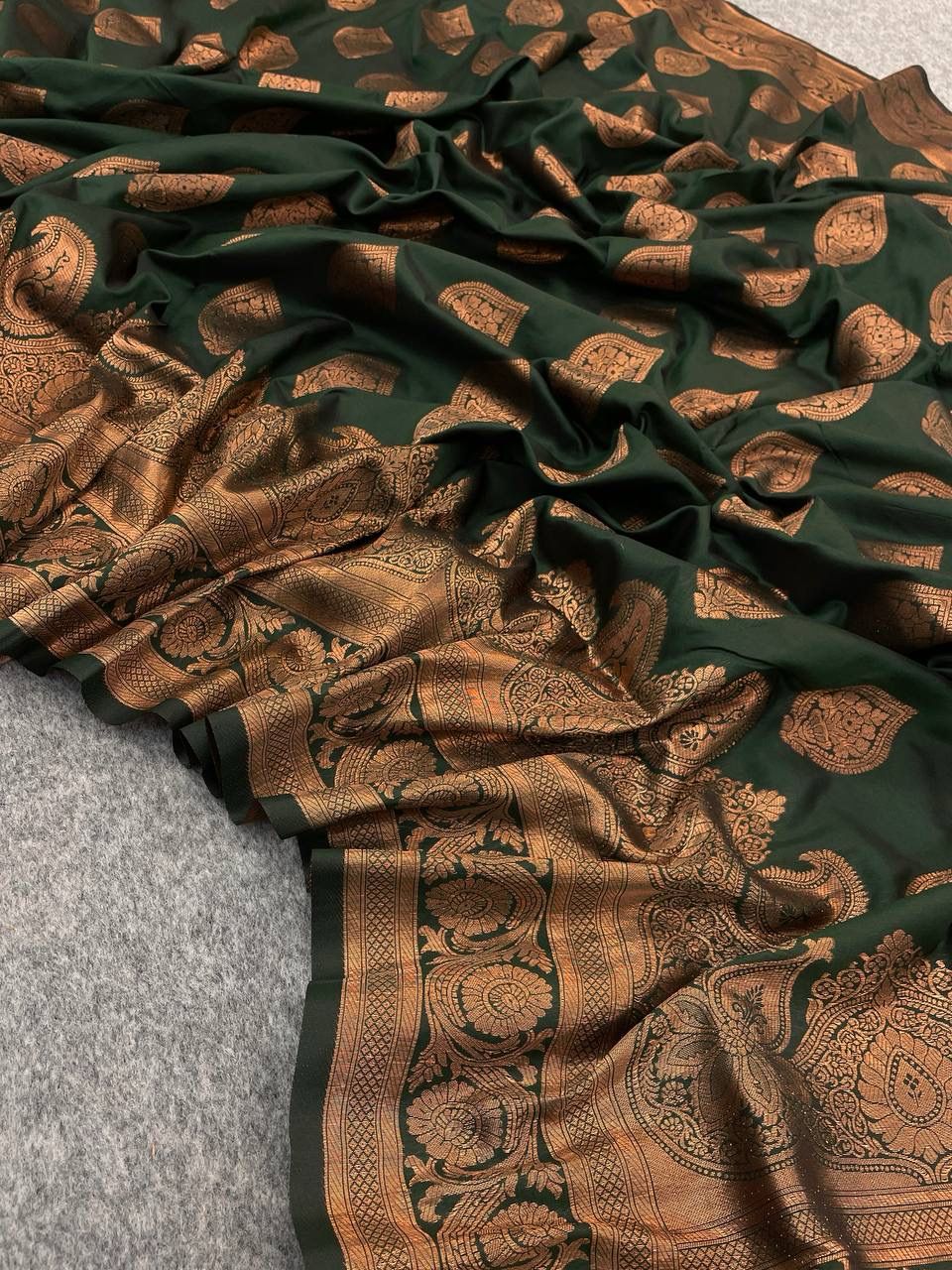 Glamorous Dark Green Color Banarasi Soft Silk Saree With Blouse Piece