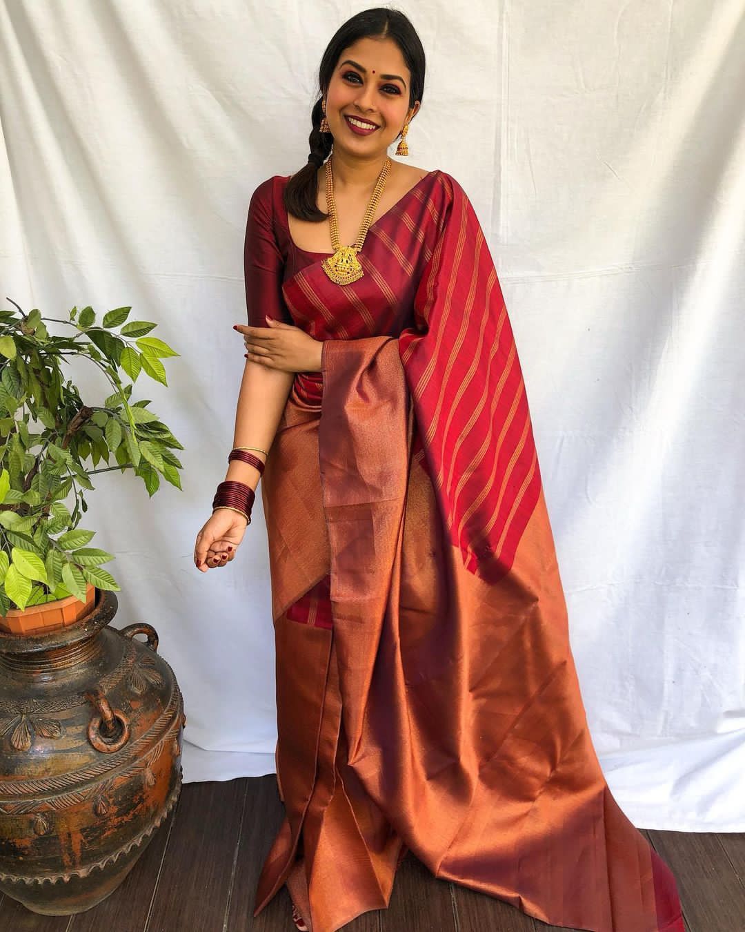 Divine Maroon Color Banarasi Soft Silk Saree With Blouse Piece