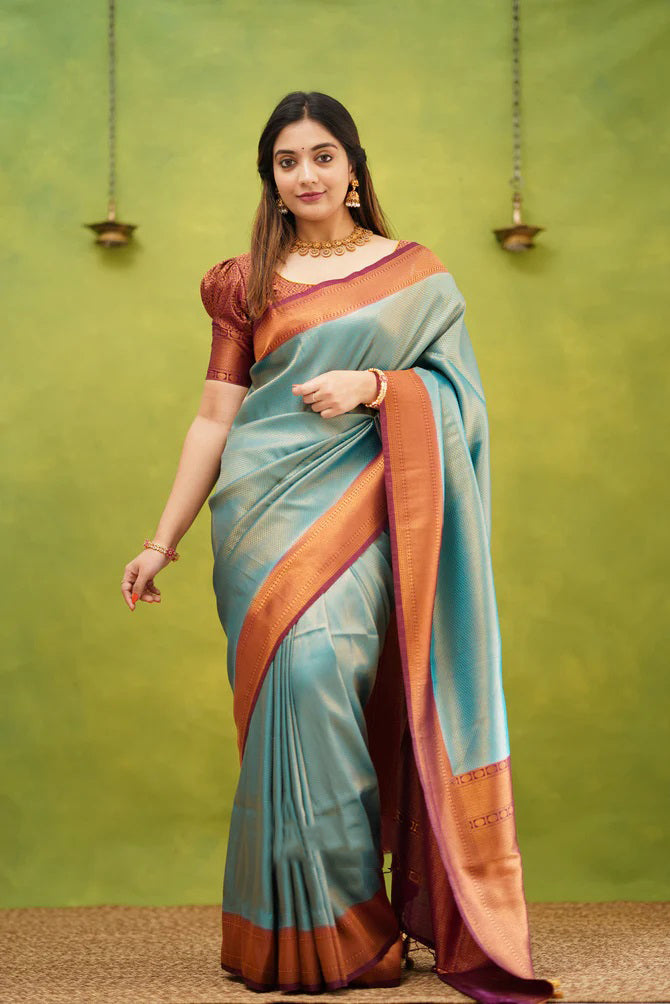 Enigmatic Firozi Color Banarasi Soft Silk Saree With Blouse Piece