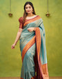 Enigmatic Firozi Color Banarasi Soft Silk Saree With Blouse Piece