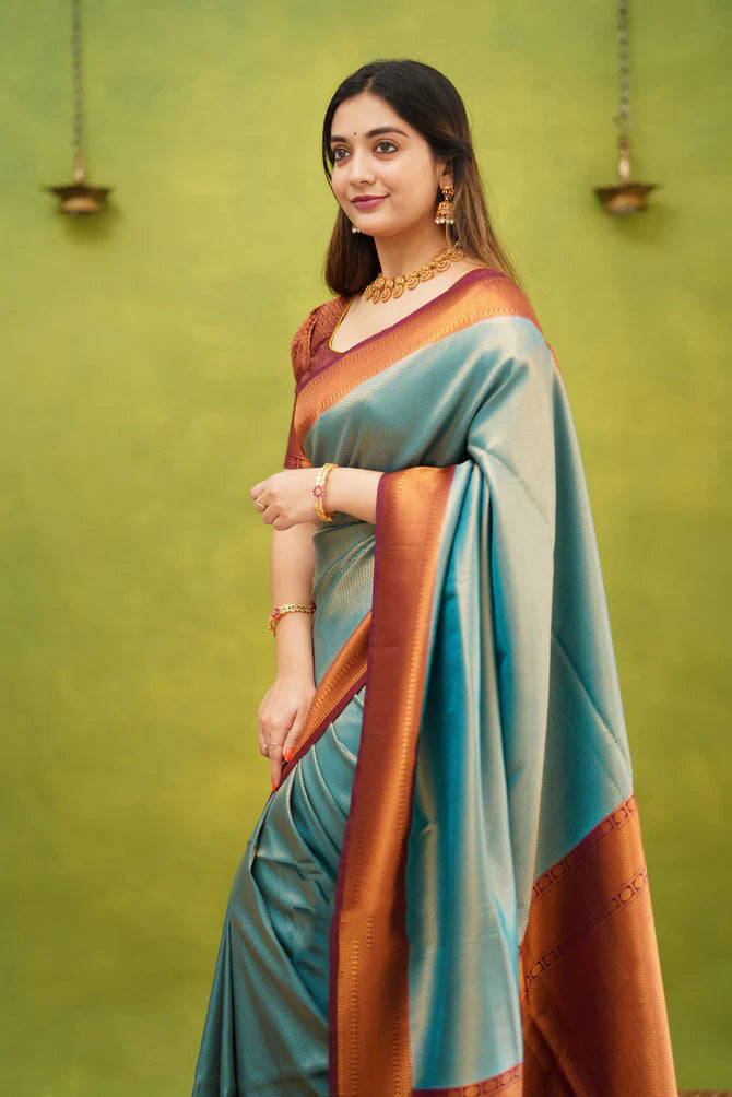 Enigmatic Firozi Color Banarasi Soft Silk Saree With Blouse Piece