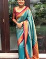 Dazzling Firozi Color Banarasi Soft Silk Saree With Blouse Piece