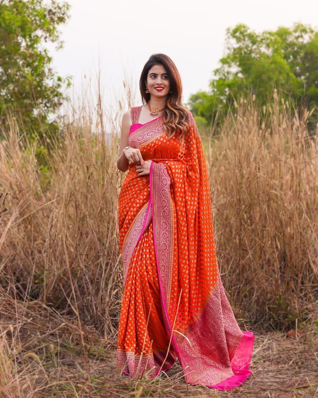 Bewitching Orange Color Banarasi Soft Silk Saree With Blouse Piece