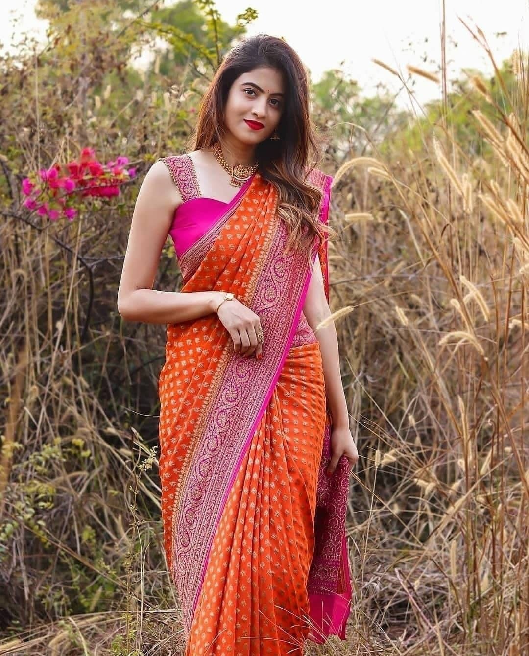 Bewitching Orange Color Banarasi Soft Silk Saree With Blouse Piece