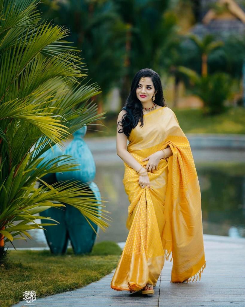 Radiant Yellow Color Banarasi Soft Silk Saree With Blouse Piece