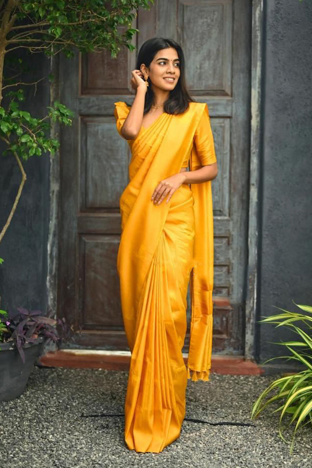 Radiant Yellow Color Soft Lichi Silk Saree With Blouse Piece