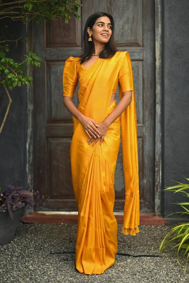 Radiant Yellow Color Soft Lichi Silk Saree With Blouse Piece