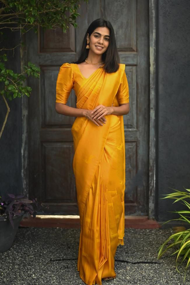 Radiant Yellow Color Soft Lichi Silk Saree With Blouse Piece