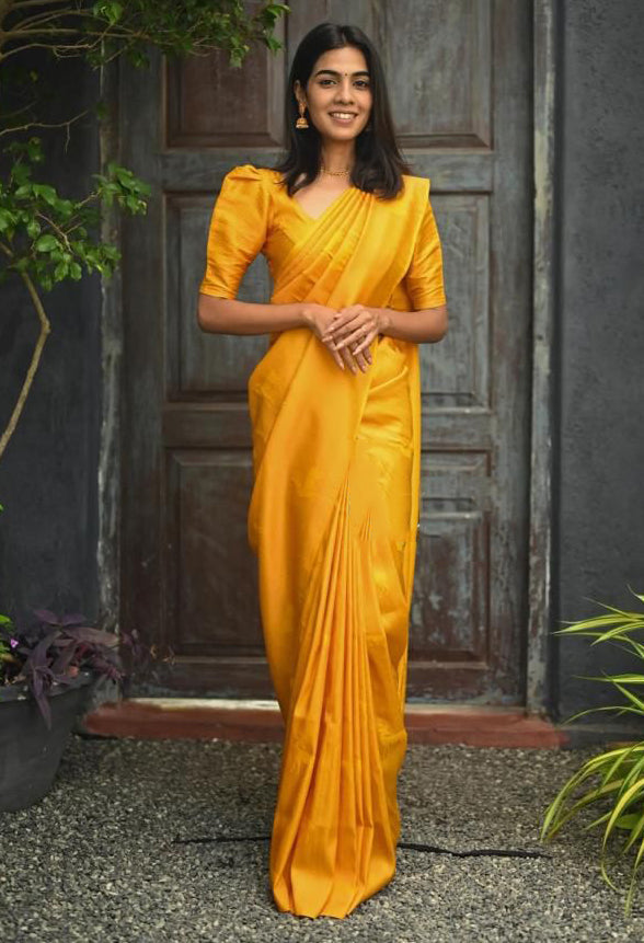 Radiant Yellow Color Soft Lichi Silk Saree With Blouse Piece