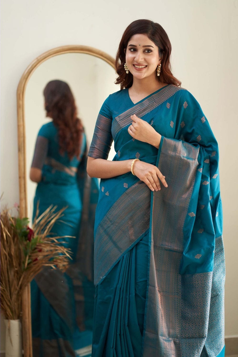 Glamorous Firozi Color Soft Lichi Silk Saree With Blouse Piece