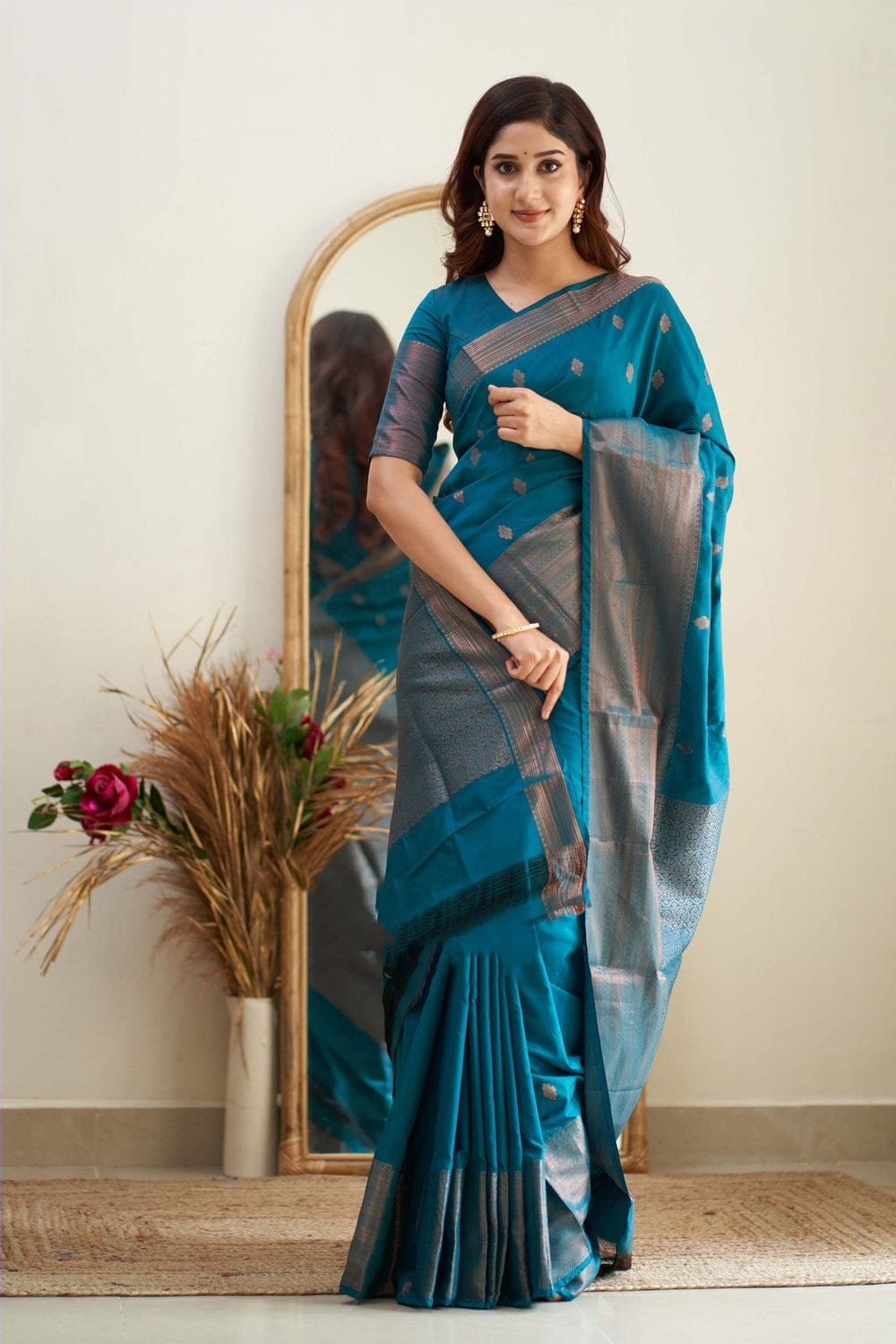 Glamorous Firozi Color Soft Lichi Silk Saree With Blouse Piece