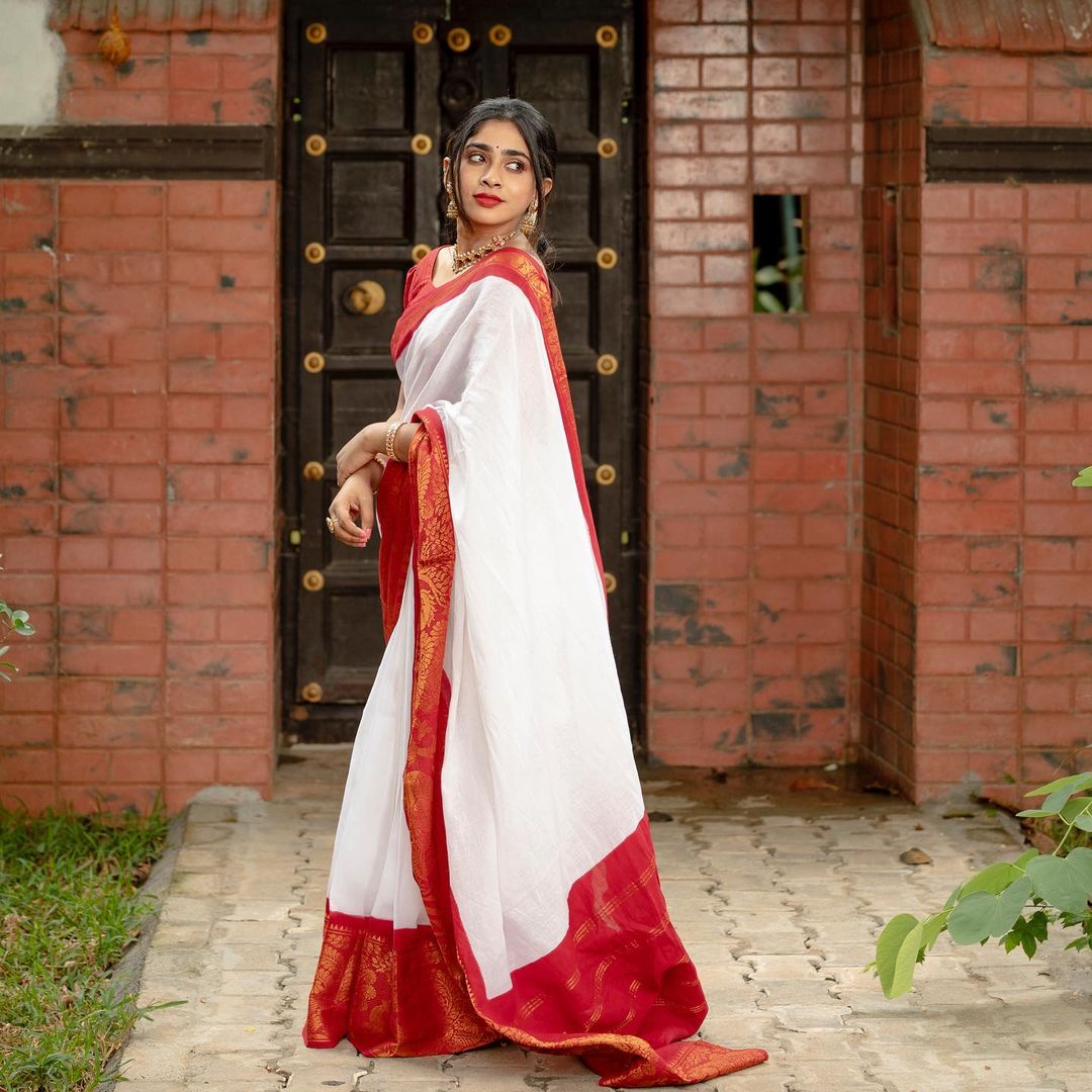 Glamorous White Color Soft Lichi Silk Saree With Blouse Piece