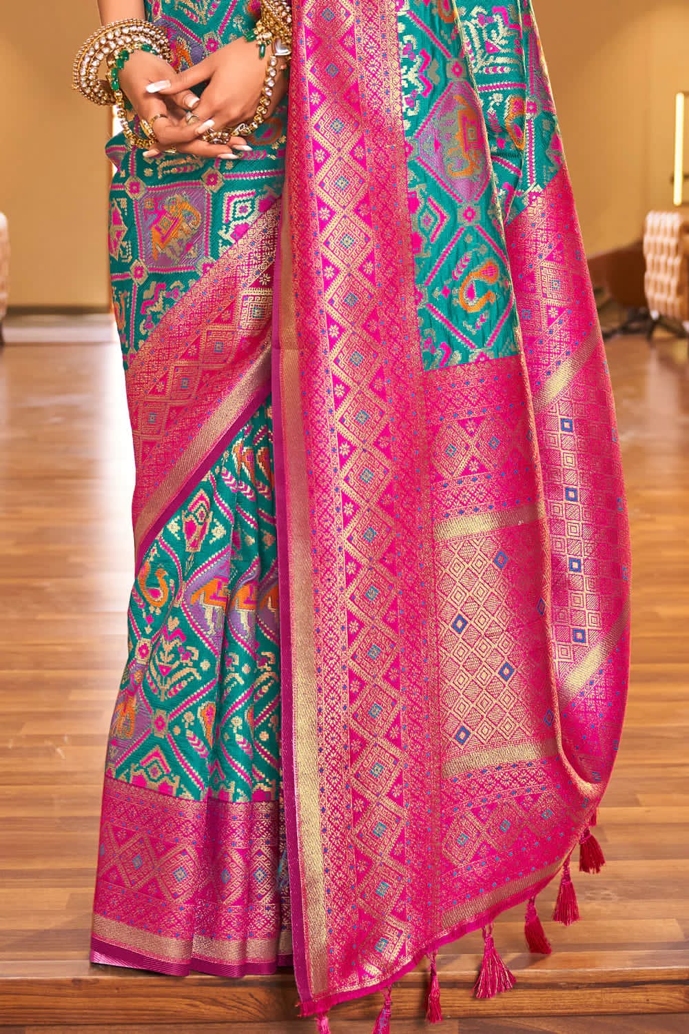 Soothing Turquoise Blue Color Patola Silk Saree